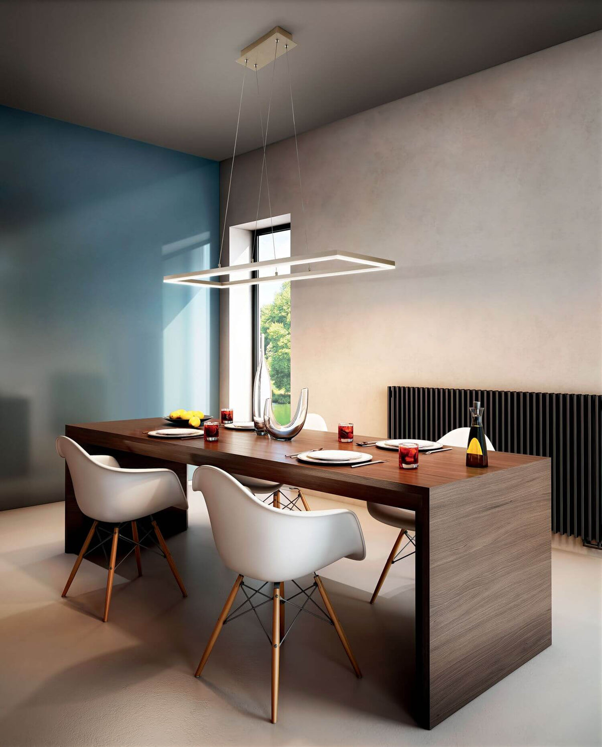 Luminaire suspendu au-dessus d'une table en bois dans une salle à manger moderne.