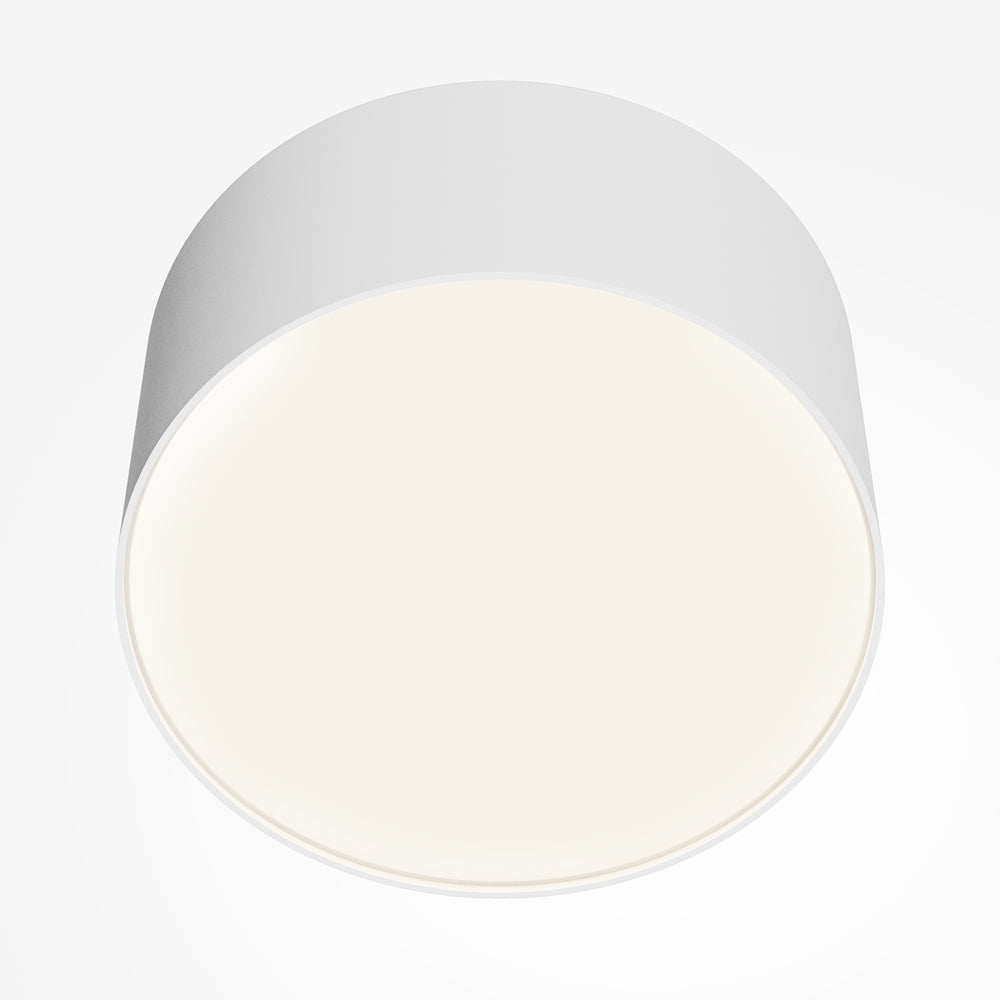 Diffuseur circulaire blanc chaud entouré de la collerette blanche du boîtier
