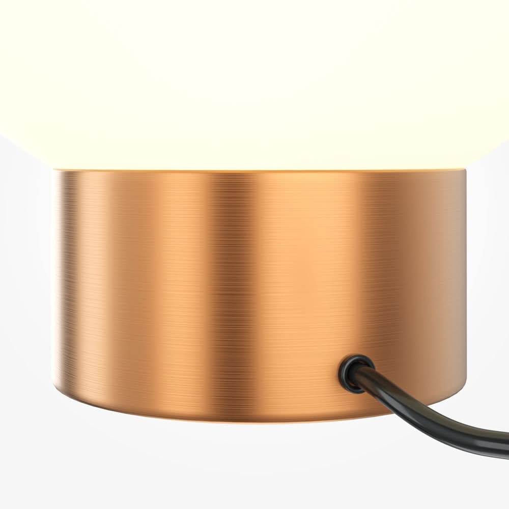 Détail macro de la base cylindrique en métal brossé cuivré