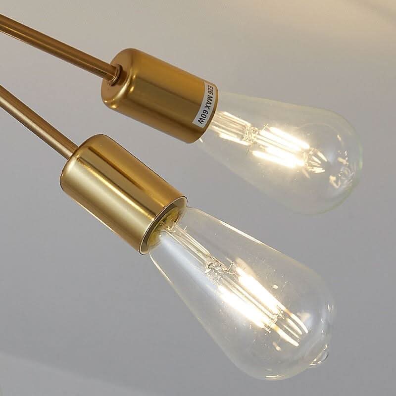 Gros plan sur douilles dorées E26 MAX 60W et ampoules à filament transparent