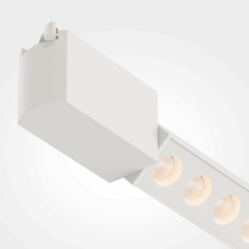 Détail rapproché des LED et de l'embout arrondi blanc du profil.