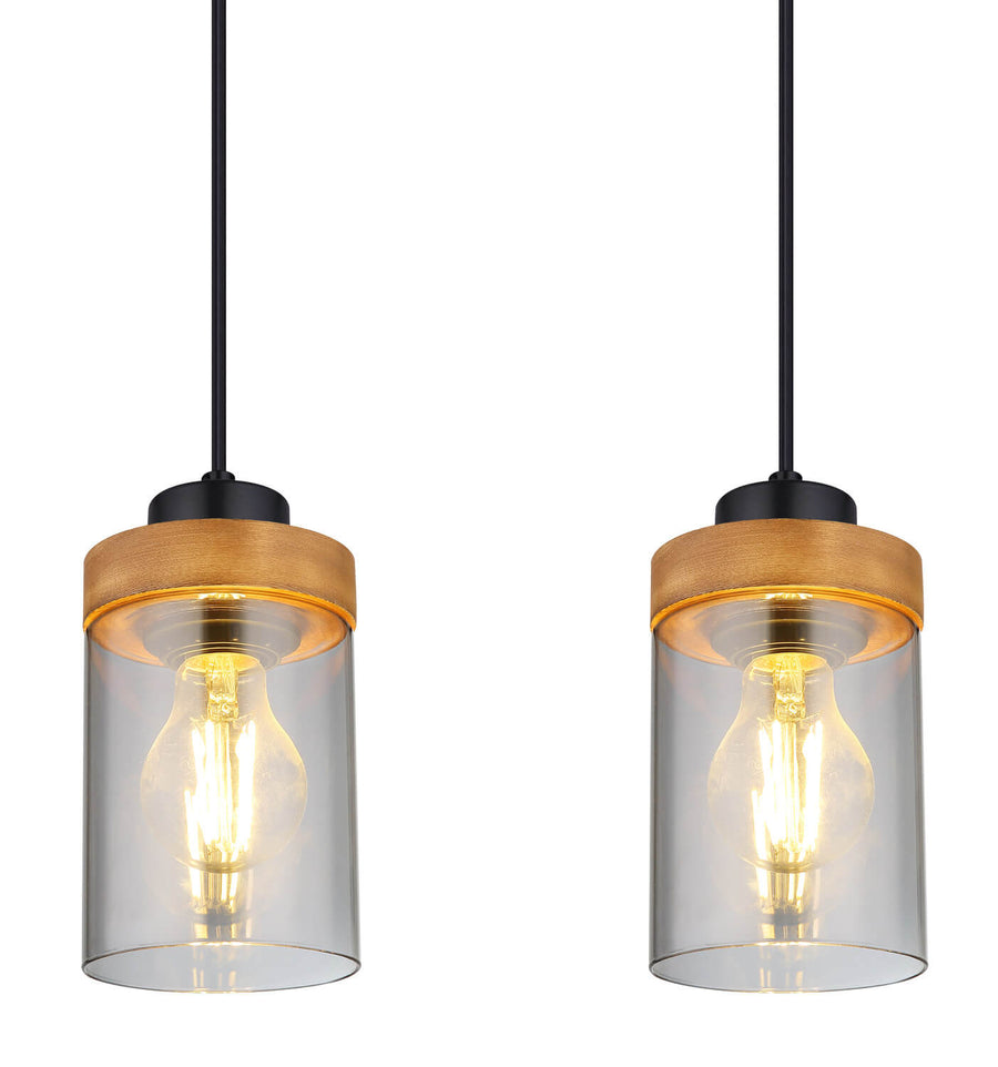 Gros plan sur deux abat-jours cylindriques avec ampoules vintage allumées