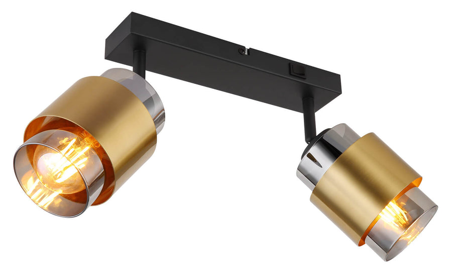 Vue rapprochée des deux projecteurs cylindriques dorés et de leur support noir