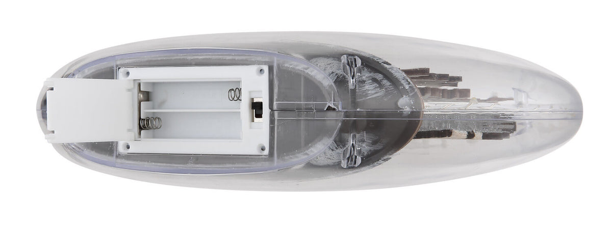 Vue de dessous montrant le compartiment à piles ouvert et l'interrupteur du luminaire.