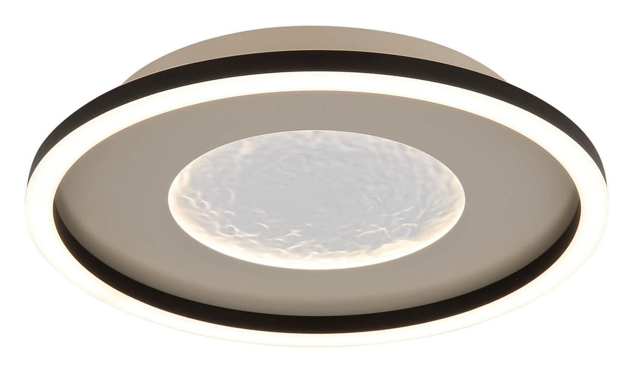 Gros plan du diffuseur central en verre texturé, lumière allumée, cerclage noir marqué.
