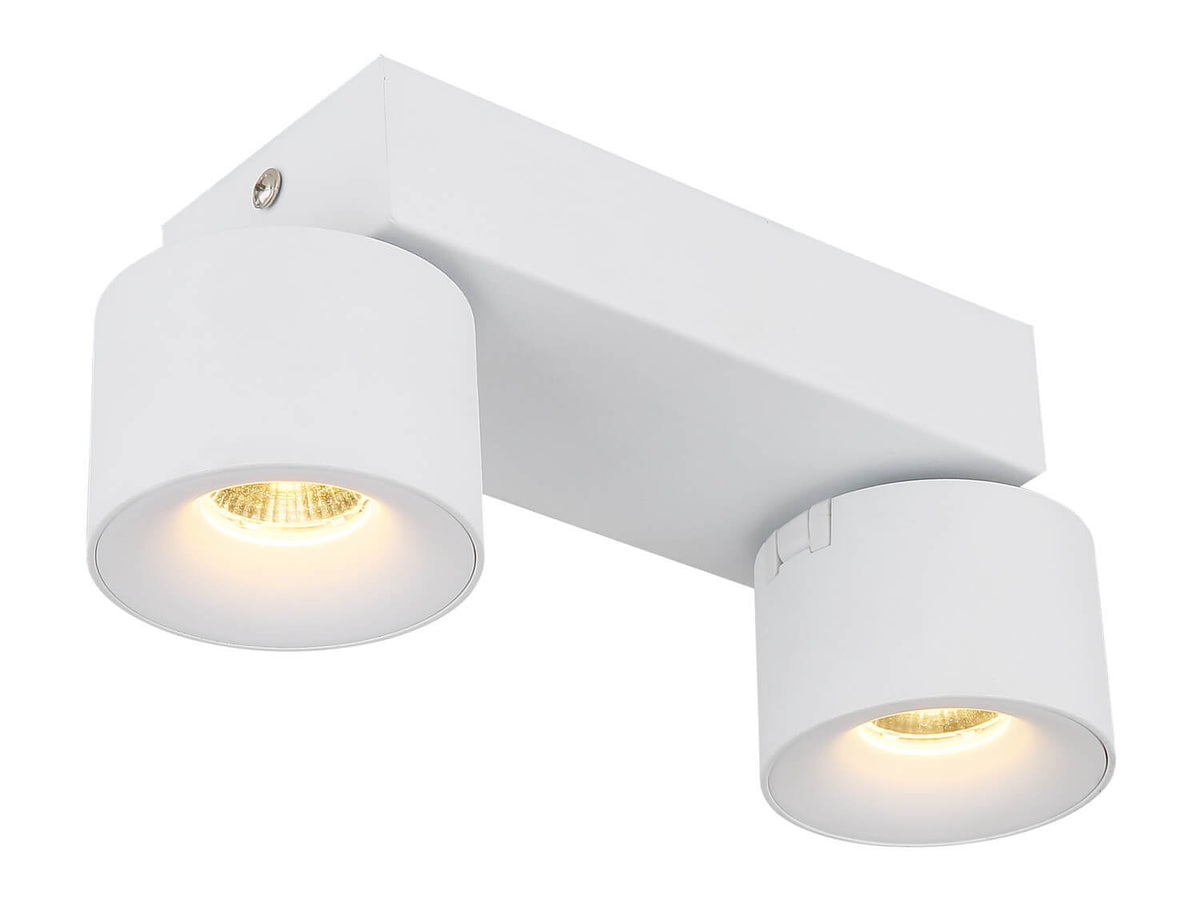 Vue en plongée du luminaire, base rectangulaire et spots cylindriques orientables blancs