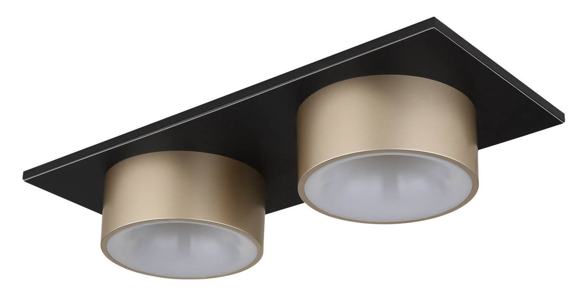 Vue de détail du luminaire éteint, mettant en valeur la finition noir mat et dorée.