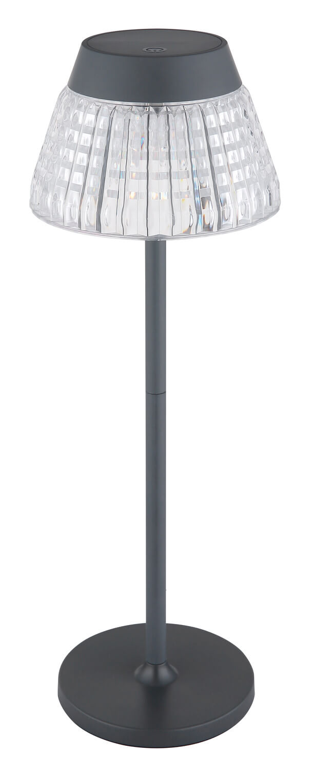 Lampe de table anthracite présentée de trois quarts, abat-jour transparent à facettes.