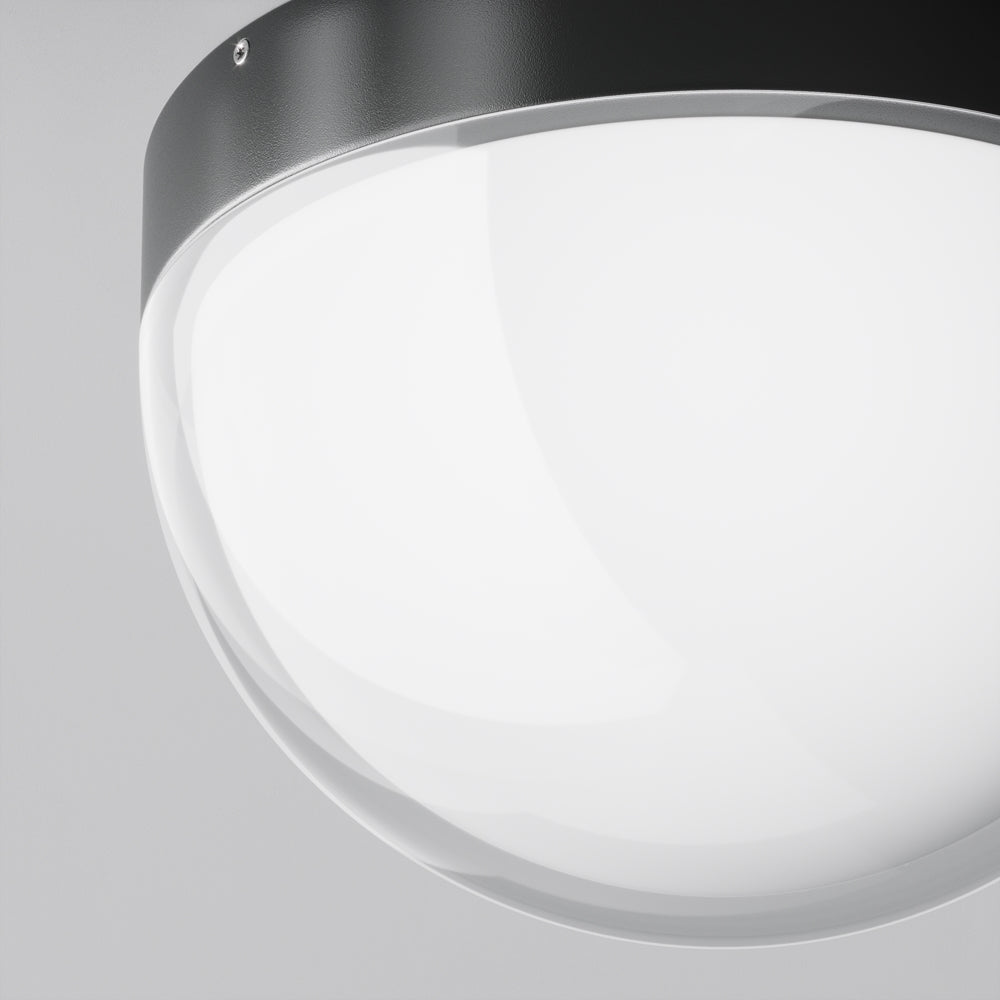Détail rapproché de la collerette métallique et du verre opalin avec vis apparente