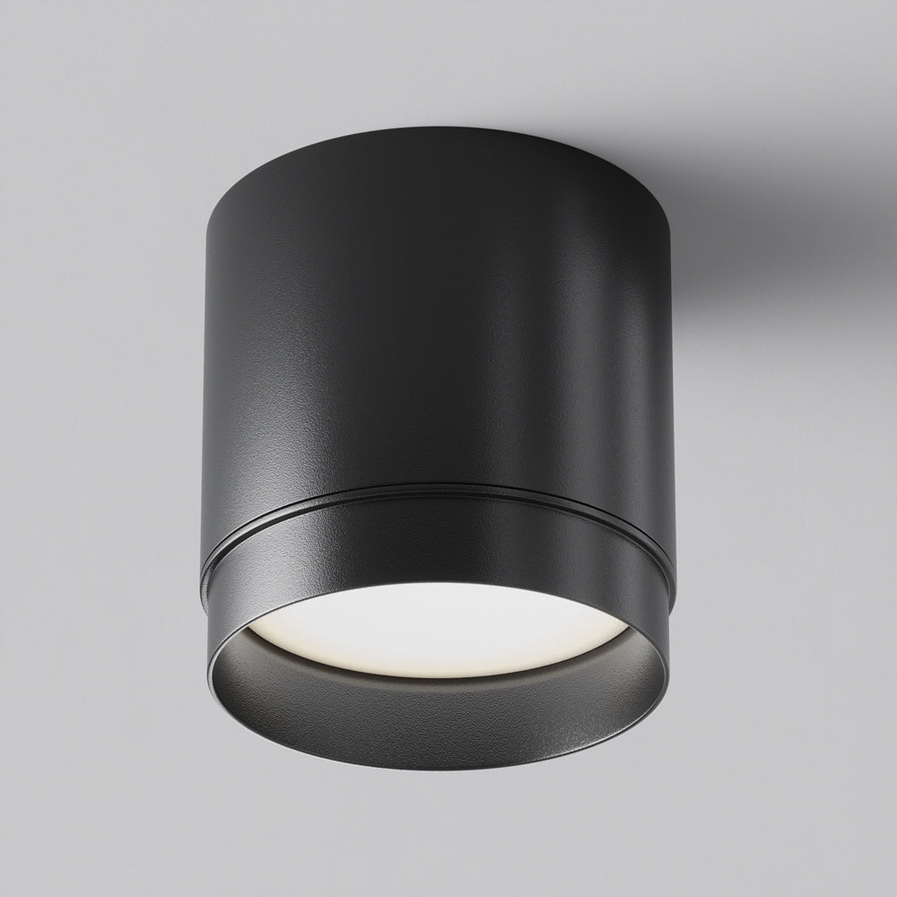 Version noire mate du même plafonnier cylindrique vue de trois quarts