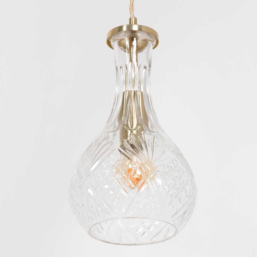 Détail rapproché du verre moulé à motif losangé et de la douille laiton