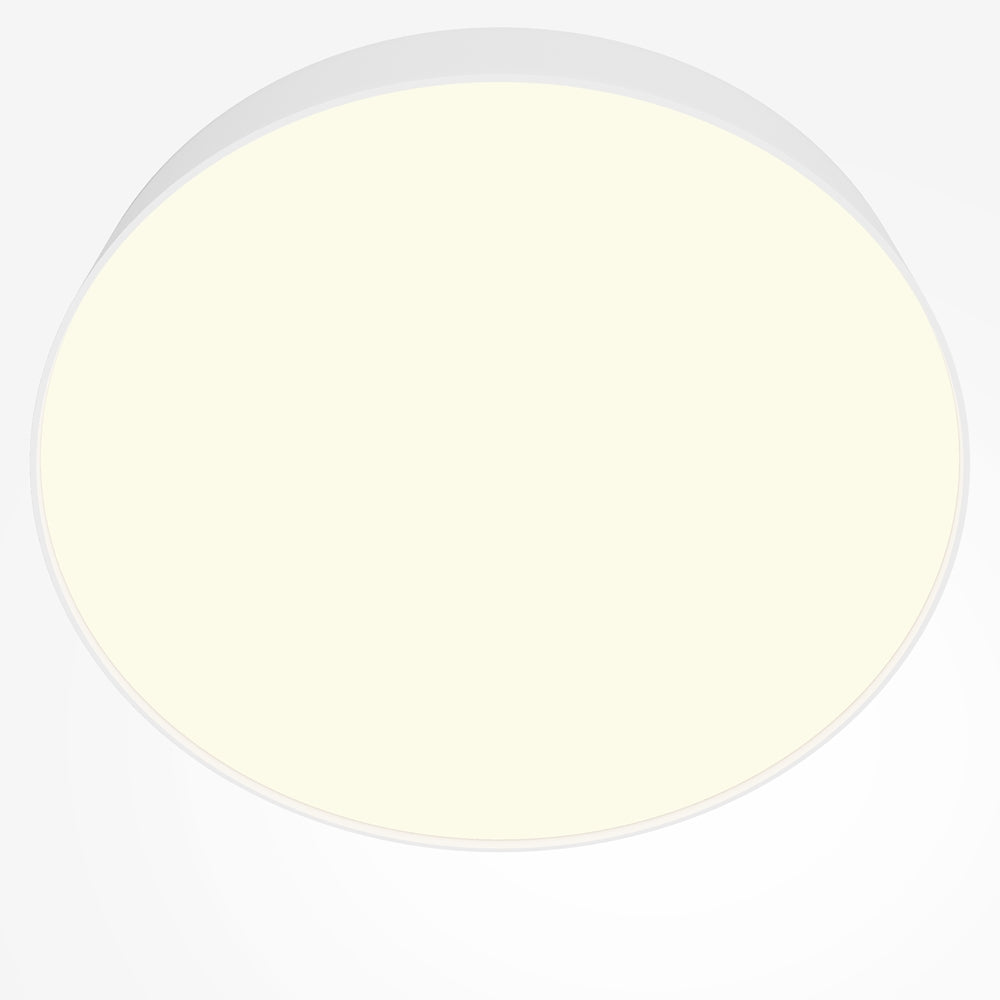 Gros plan du diffuseur rond allumé, lumière chaude et contour blanc fin