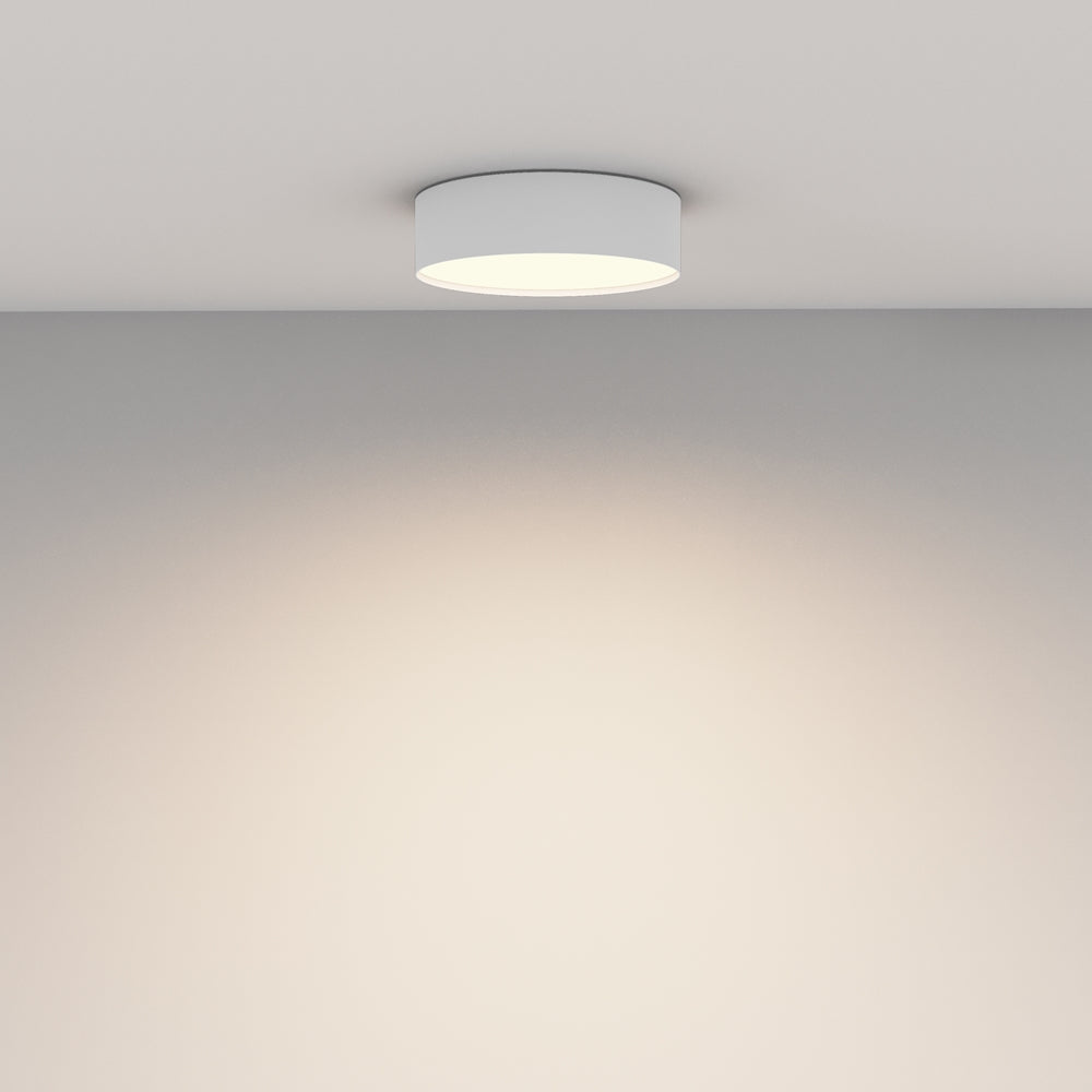 Mise en ambiance : halo lumineux diffus projeté sur le mur et le plafond