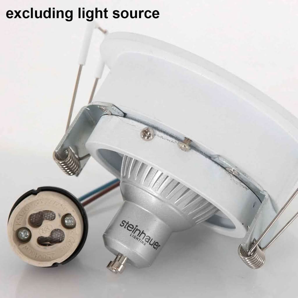 Spot blanc sans ampoule, douille GU10 et ampoule LED séparée posée à côté