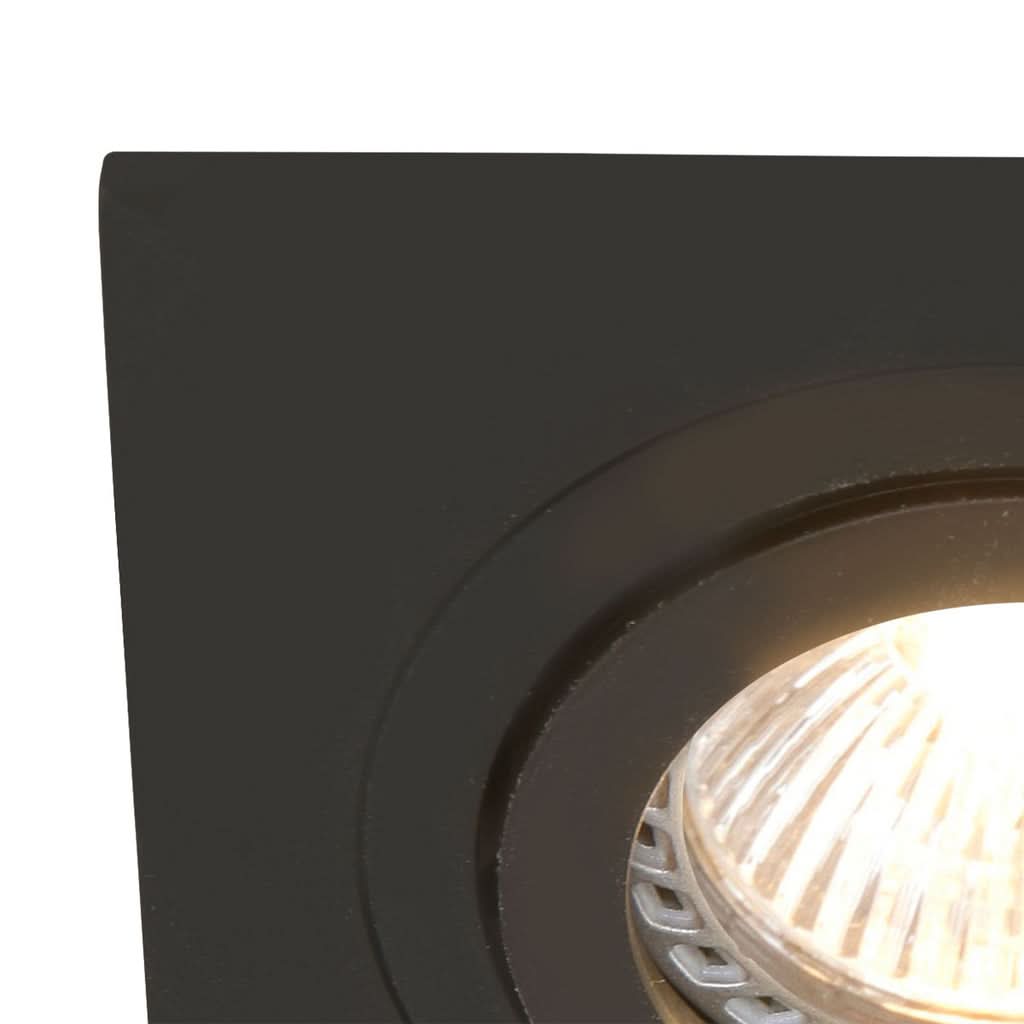 Détail de l'angle du cadre carré noir et de la bague intérieure, spot allumé.