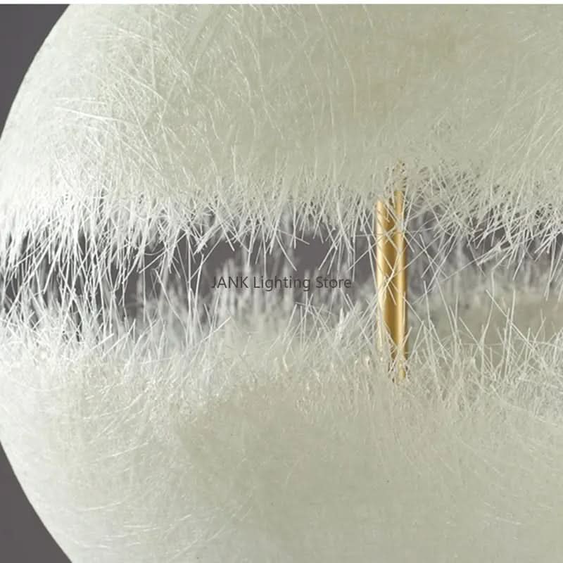 Détail de la bande centrale en fibre et de la tige dorée traversante
