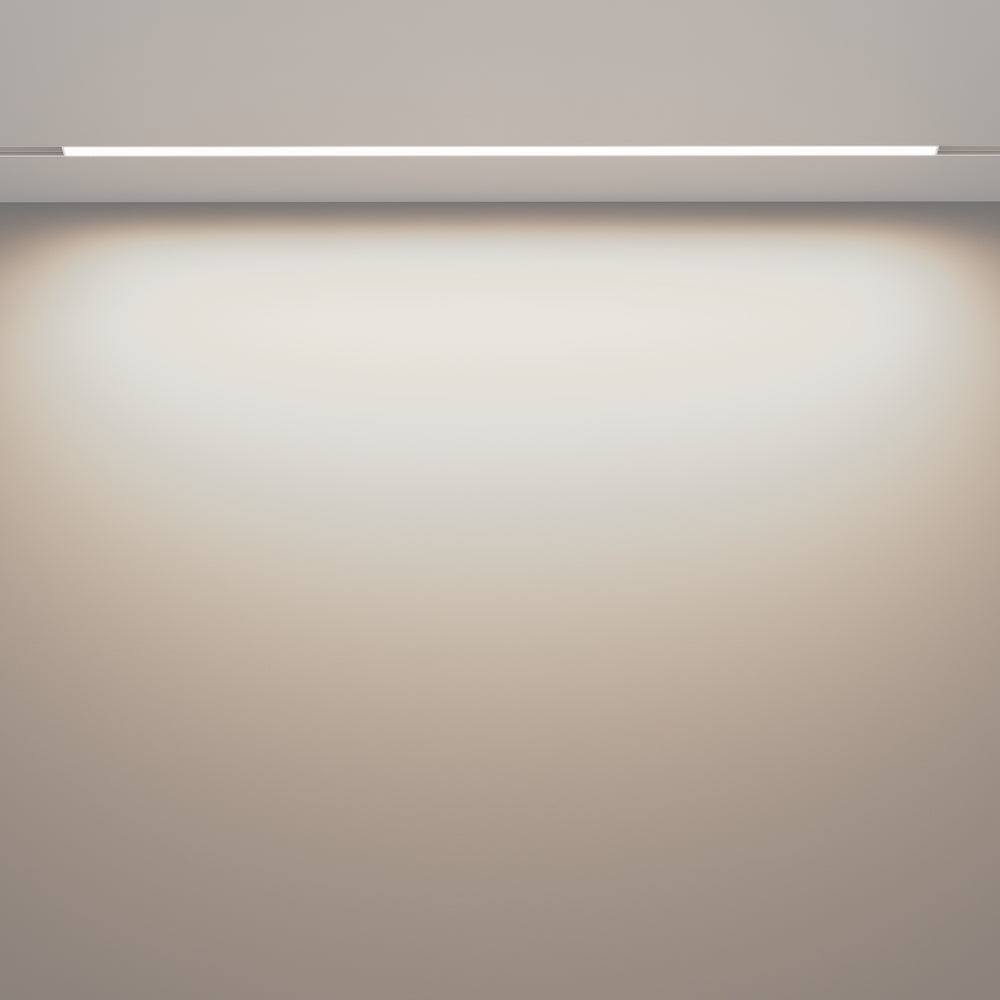 Effet de lumière rasante sur un mur depuis un luminaire encastré au plafond
