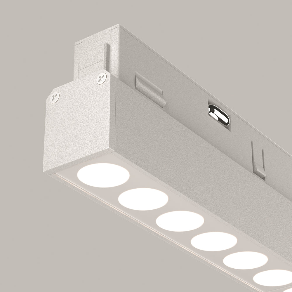 Détail rapproché du module blanc avec diodes rondes régulièrement espacées et bord biseauté.