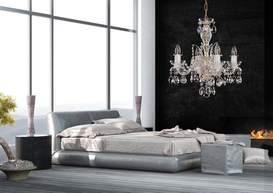 Lustre suspendu au-dessus d'un lit dans une chambre moderne