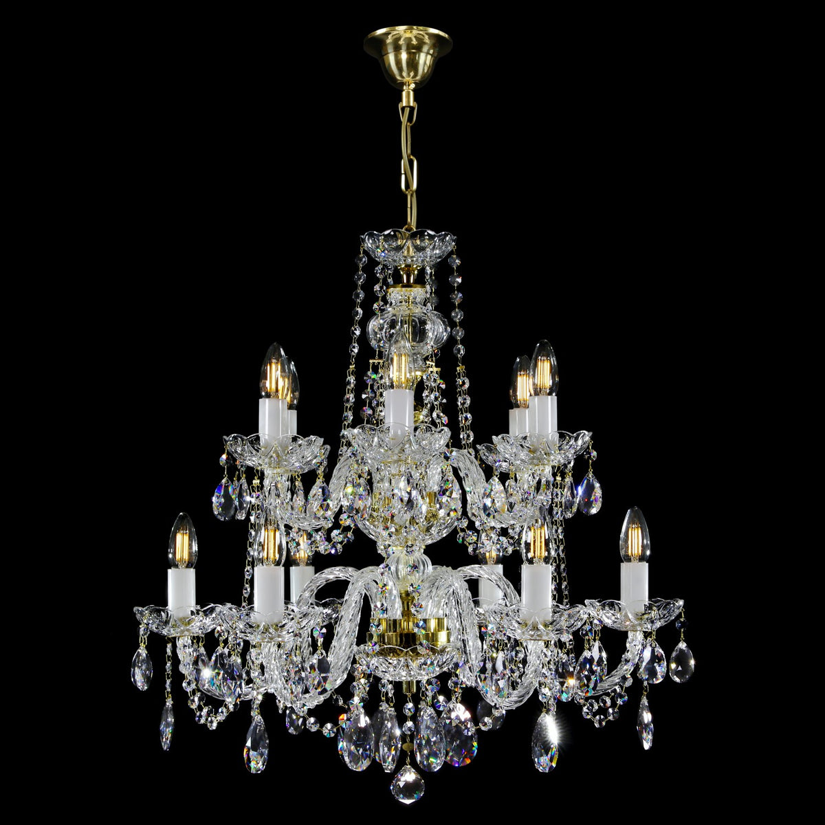 Version dorée du luminaire, bras ciselés en cristal et ampoules allumées