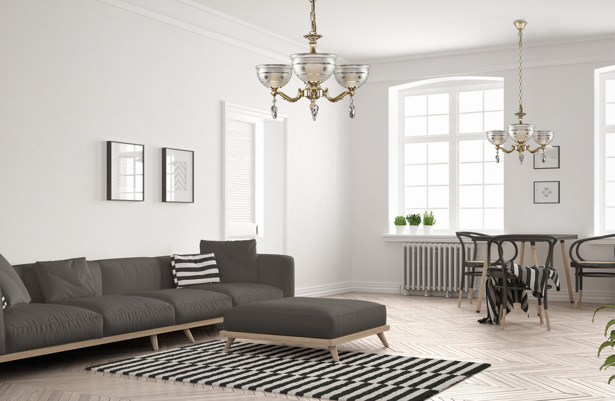 Lustre suspendu dans un salon blanc moderne avec canapé gris et coin repas.