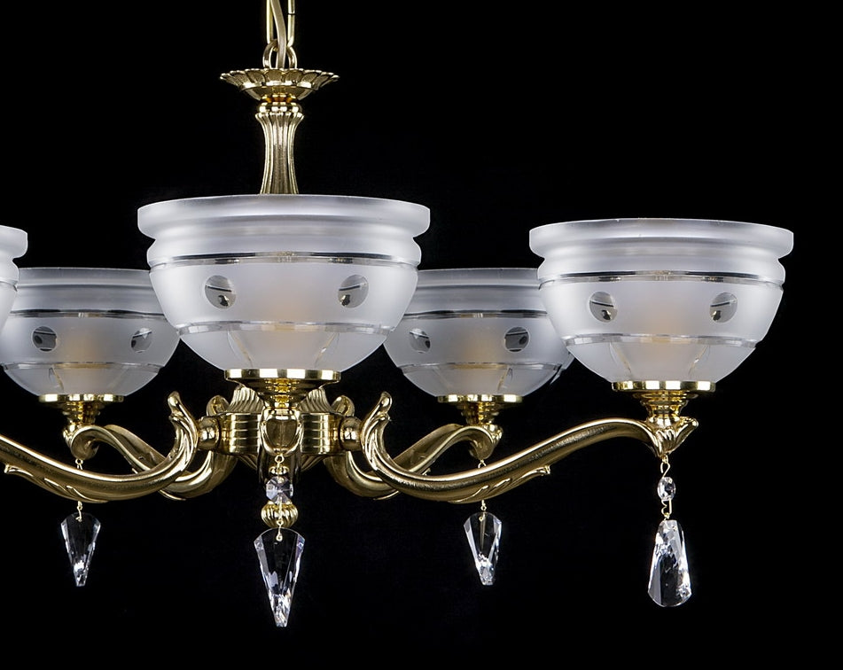 Détail des bras dorés recourbés et des coupelles en verre dépoli strié