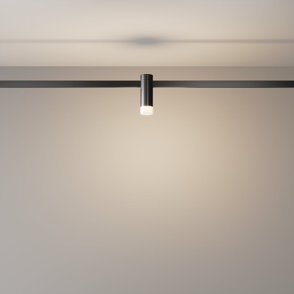 Mise en ambiance dans une pièce sombre, spot allumé diffusant un halo