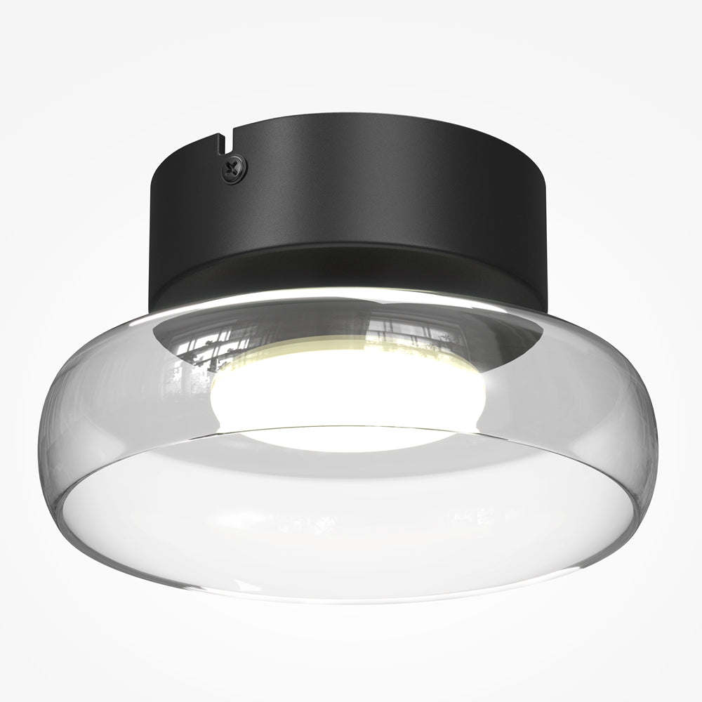 Vue rapprochée en contre-plongée du diffuseur en verre allumé sous la base noire