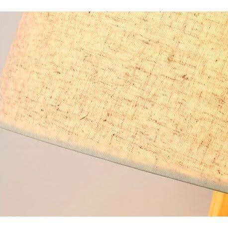 Gros plan de la finition textile beige chinée de l'abat-jour