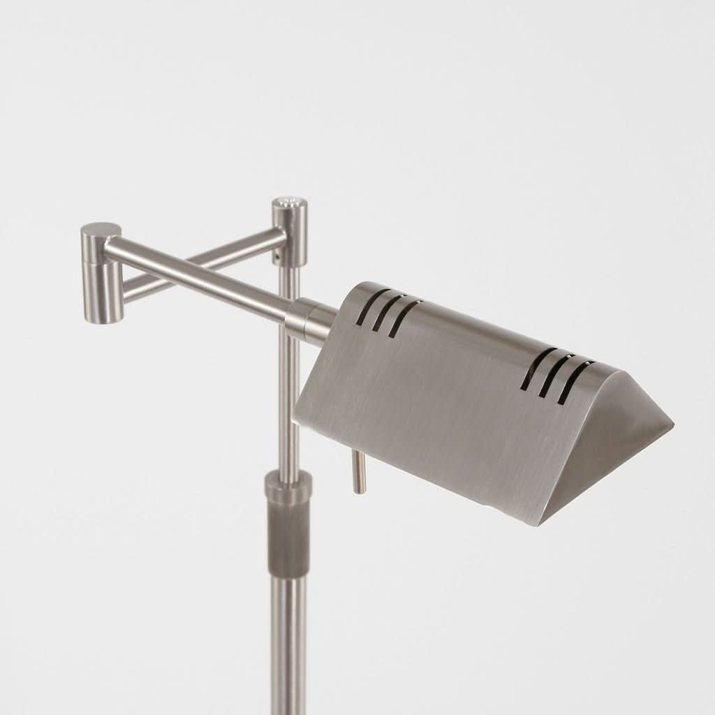 Détail de la tête rectangulaire orientable avec fentes d'aération et finition acier brossé.