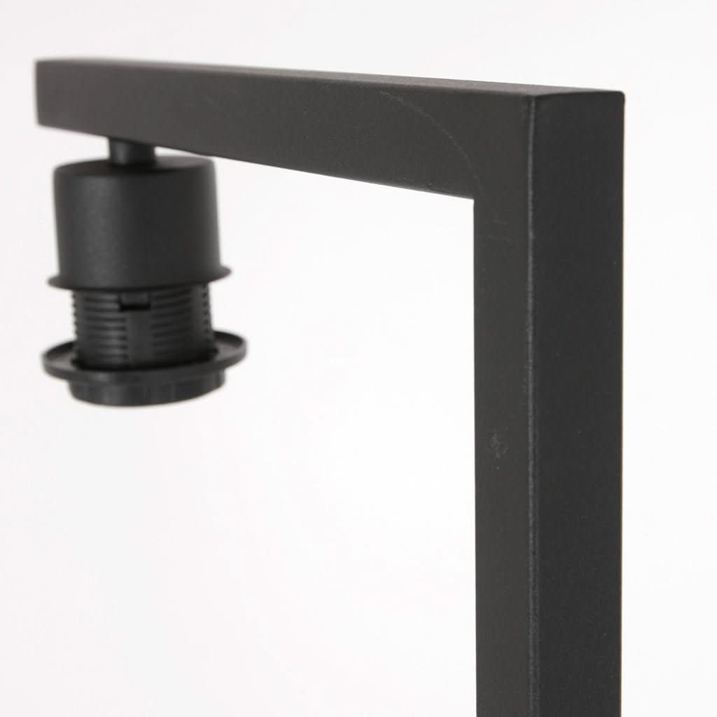Détail du bras coudé noir et de la douille suspendue, sans abat-jour ni ampoule.