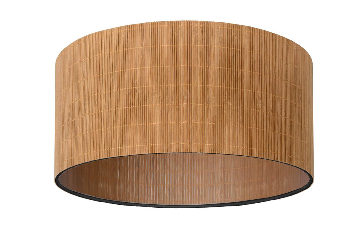Vue de trois quarts du plafonnier cylindrique avec bordure noire et lueur intérieure.