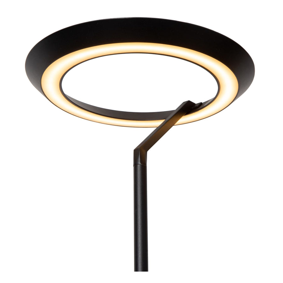 Détail du cercle lumineux et de l'articulation en métal noir.