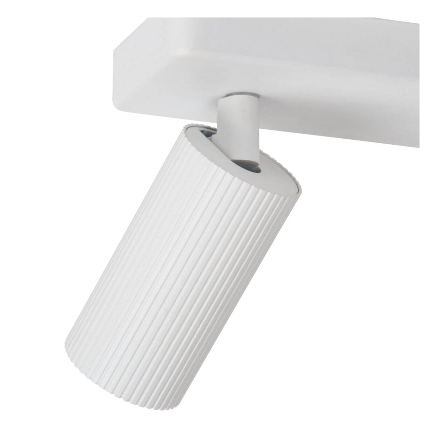 Détail rapproché de la rotule et du cylindre strié blanc, orienté vers le bas