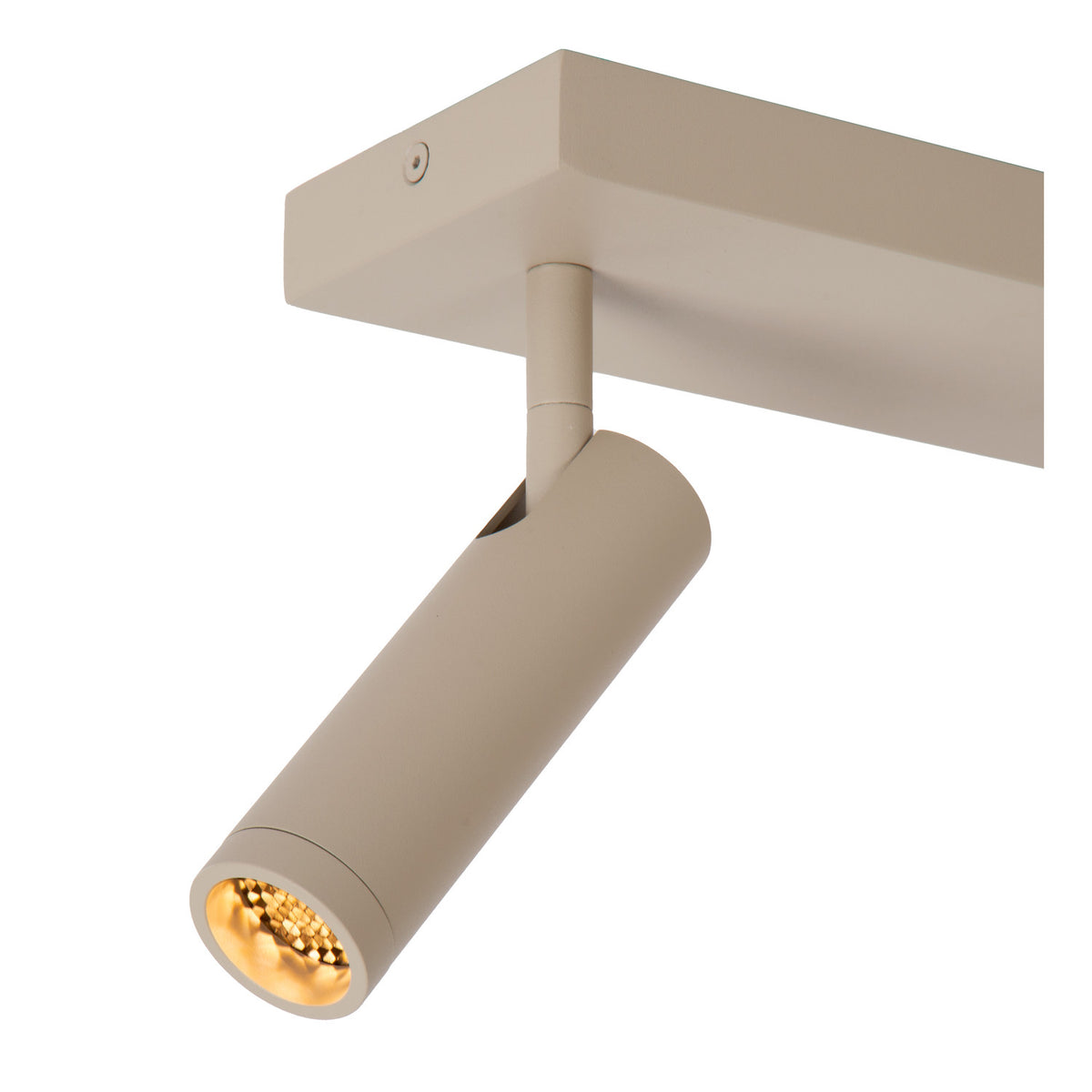 Gros plan sur une tête cylindrique taupe allumée avec LED dorée apparente.