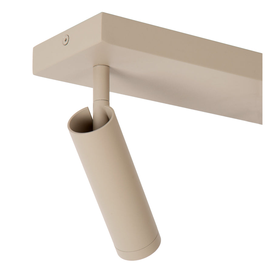 Détail de l'arrière d'un spot cylindrique taupe et de sa fixation au plafond.