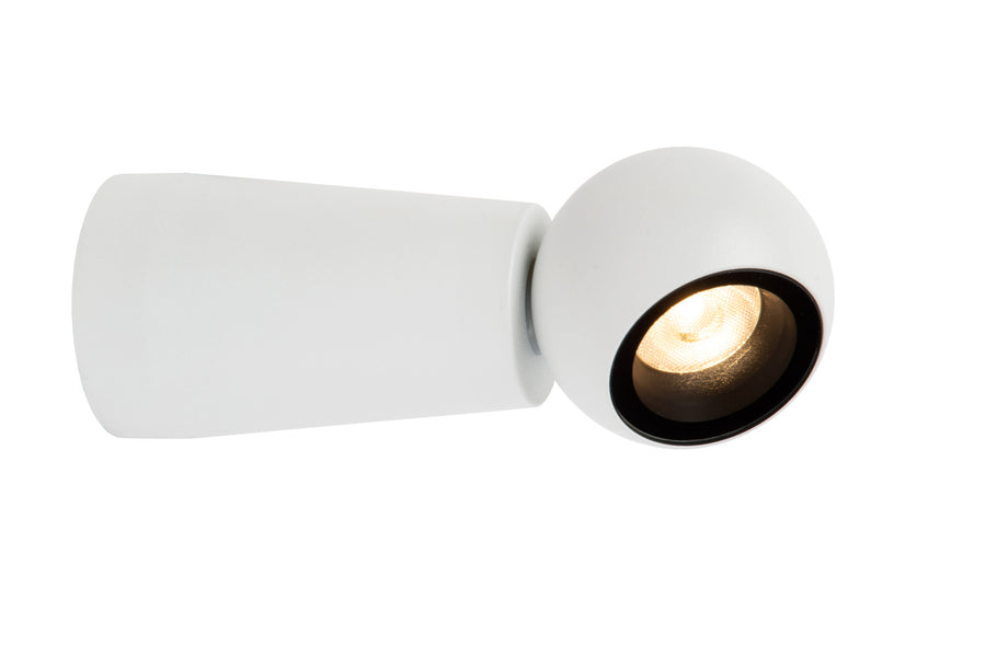 Autre angle rapproché montrant le projecteur sphérique allumé et son support cylindrique.