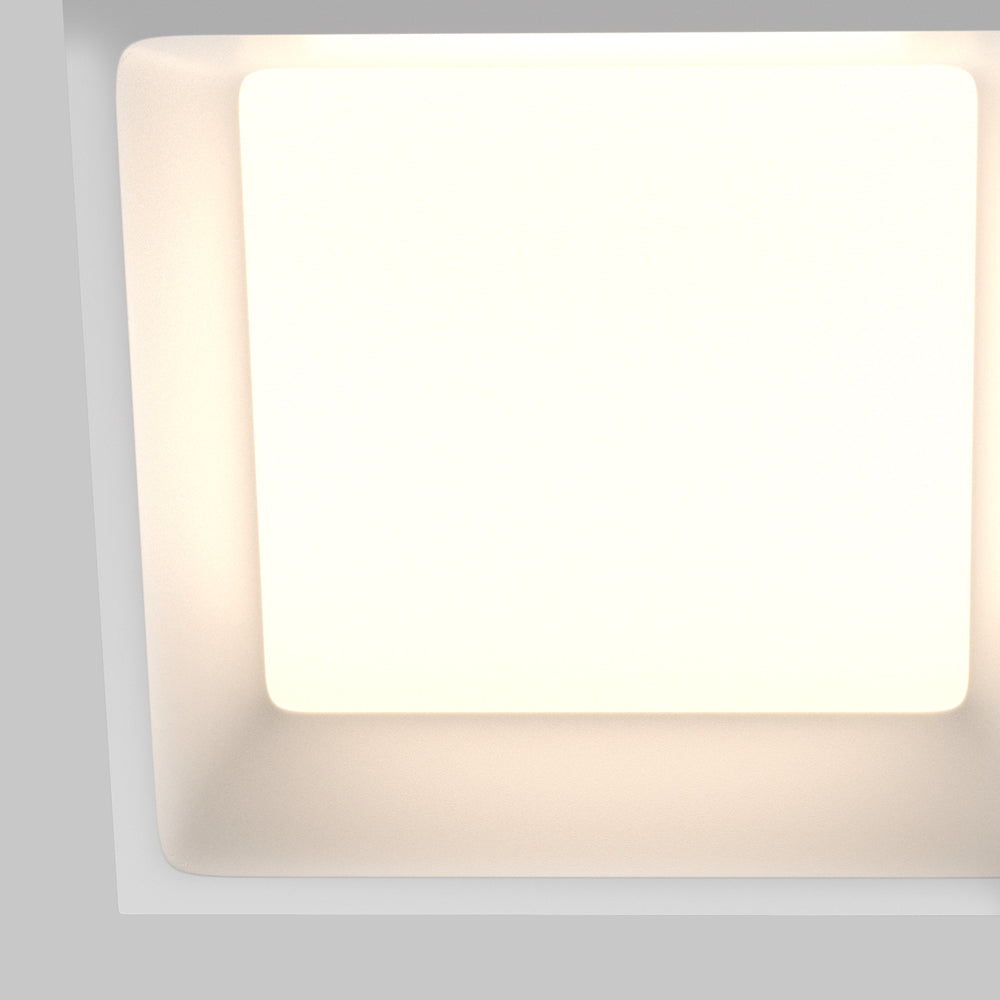 Gros plan sur le diffuseur carré lumineux et son cadre arrondi blanc