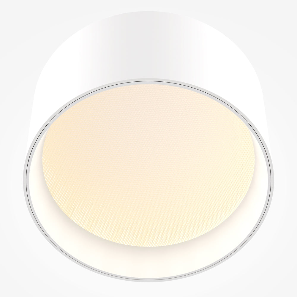 Vue rapprochée du bas de l'abat-jour montrant la grille diffuseur crème texturée