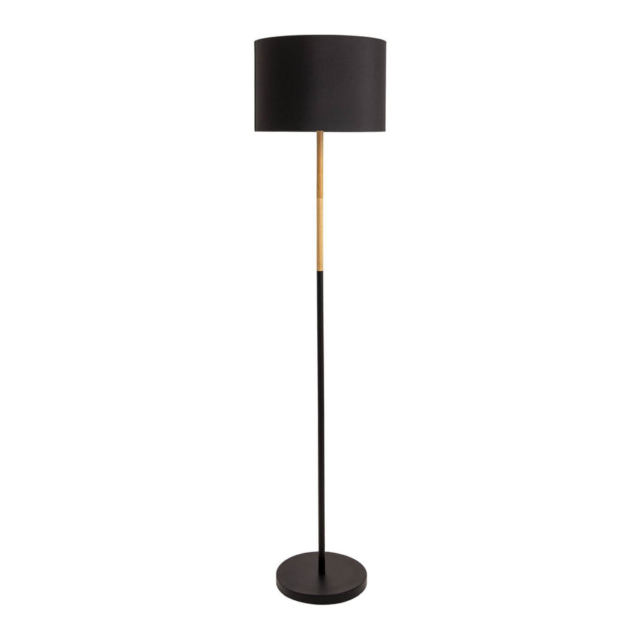 Lampadaire noir sur fond blanc, abat-jour tambour et pied fin bicolore
