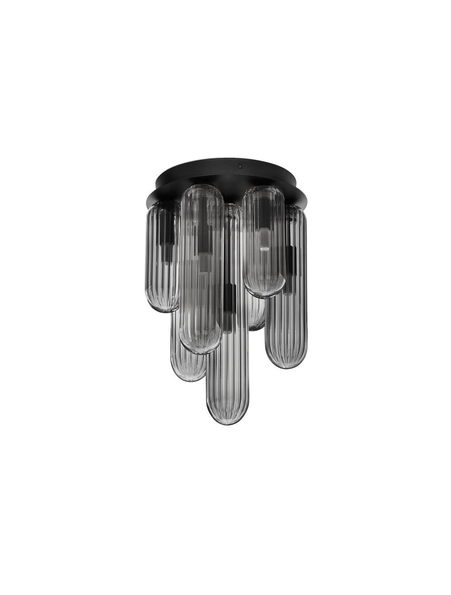 Produit de face sur fond blanc, capuchon noir et tubes de verre éteints