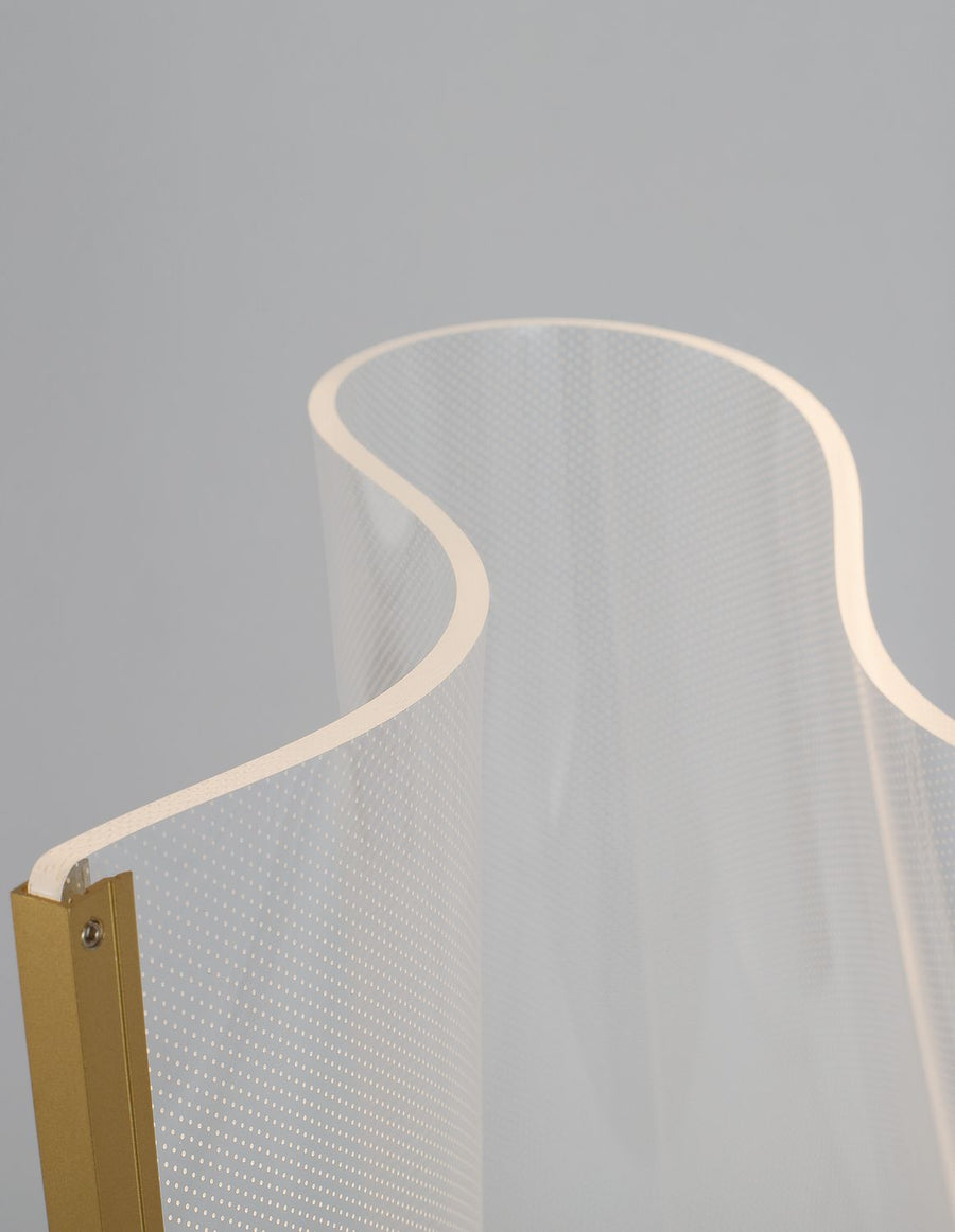 Détail du bord supérieur, ruban LED et fixation dorée avec vis apparente.
