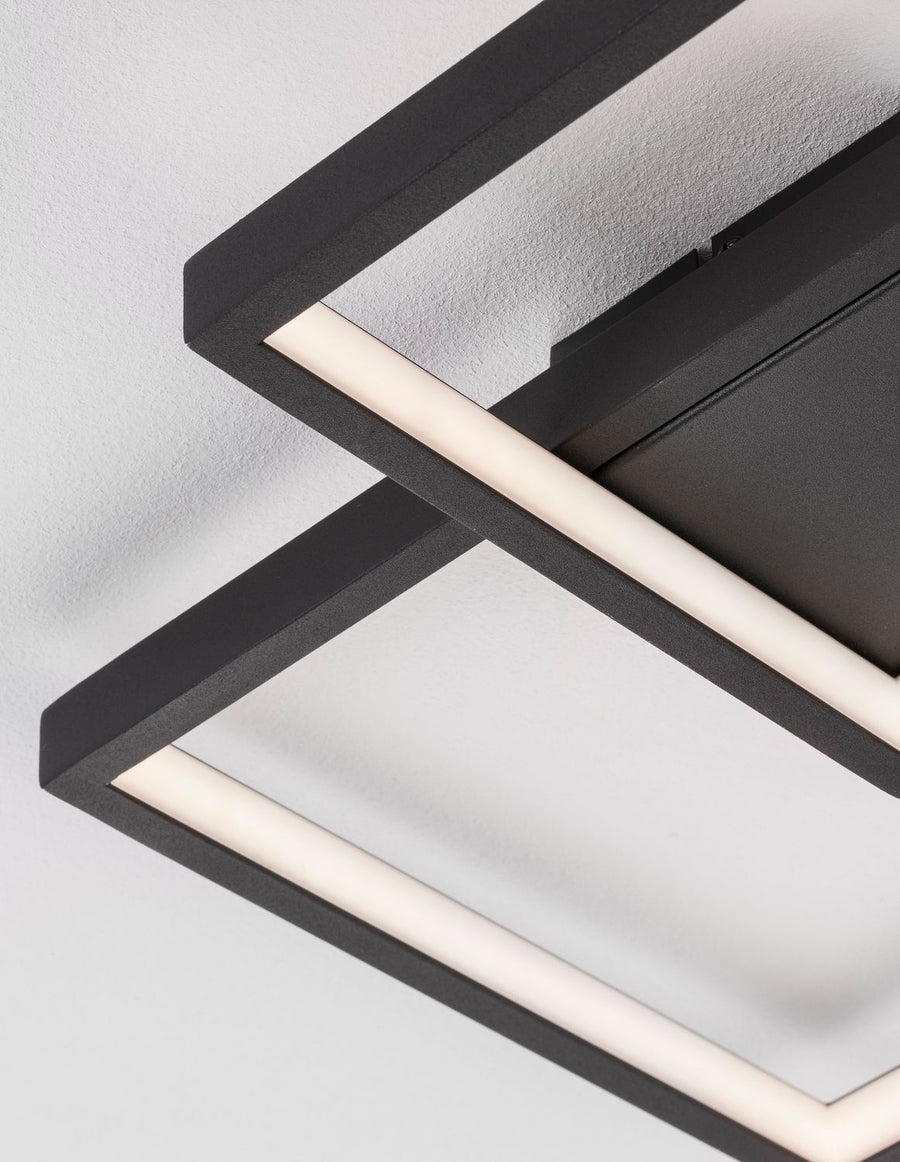 Détail rapproché du cadre noir et du diffuseur LED blanc intégré