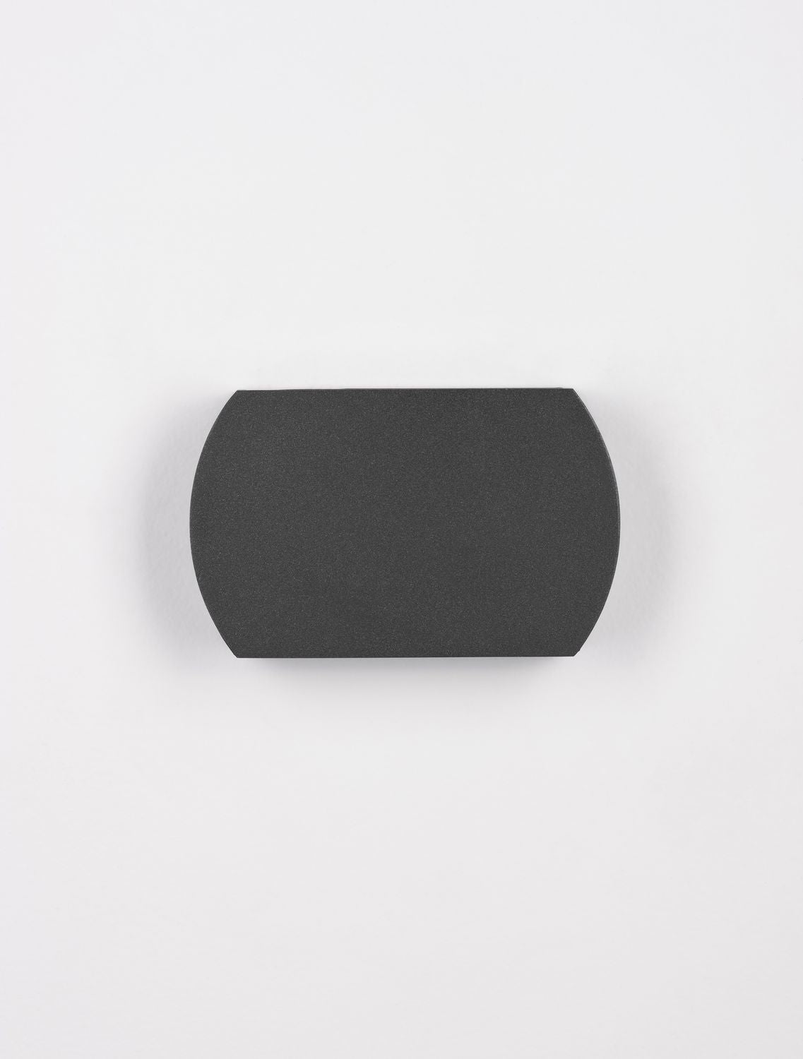 Vue de face avec halo lumineux diffusé vers le haut sur mur blanc