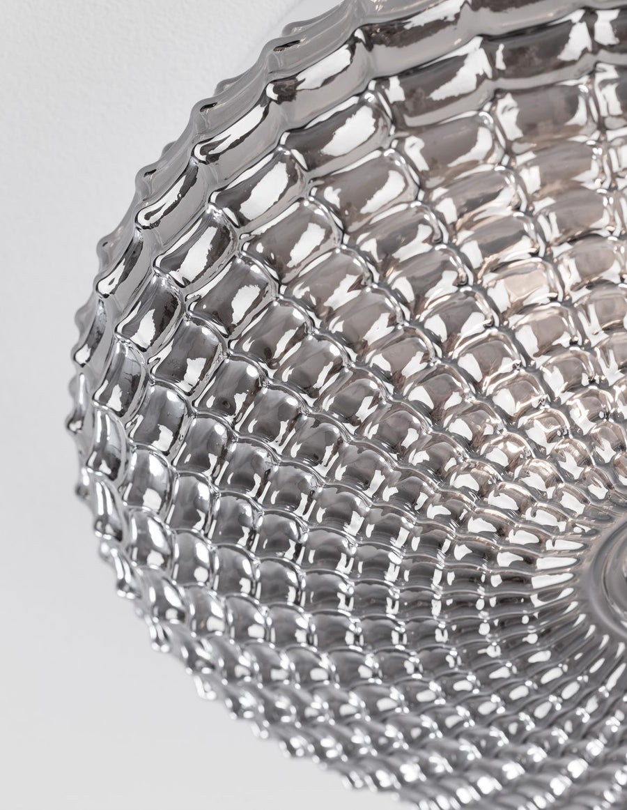 Détail rapproché du verre fumé et de sa texture en nid d'abeille
