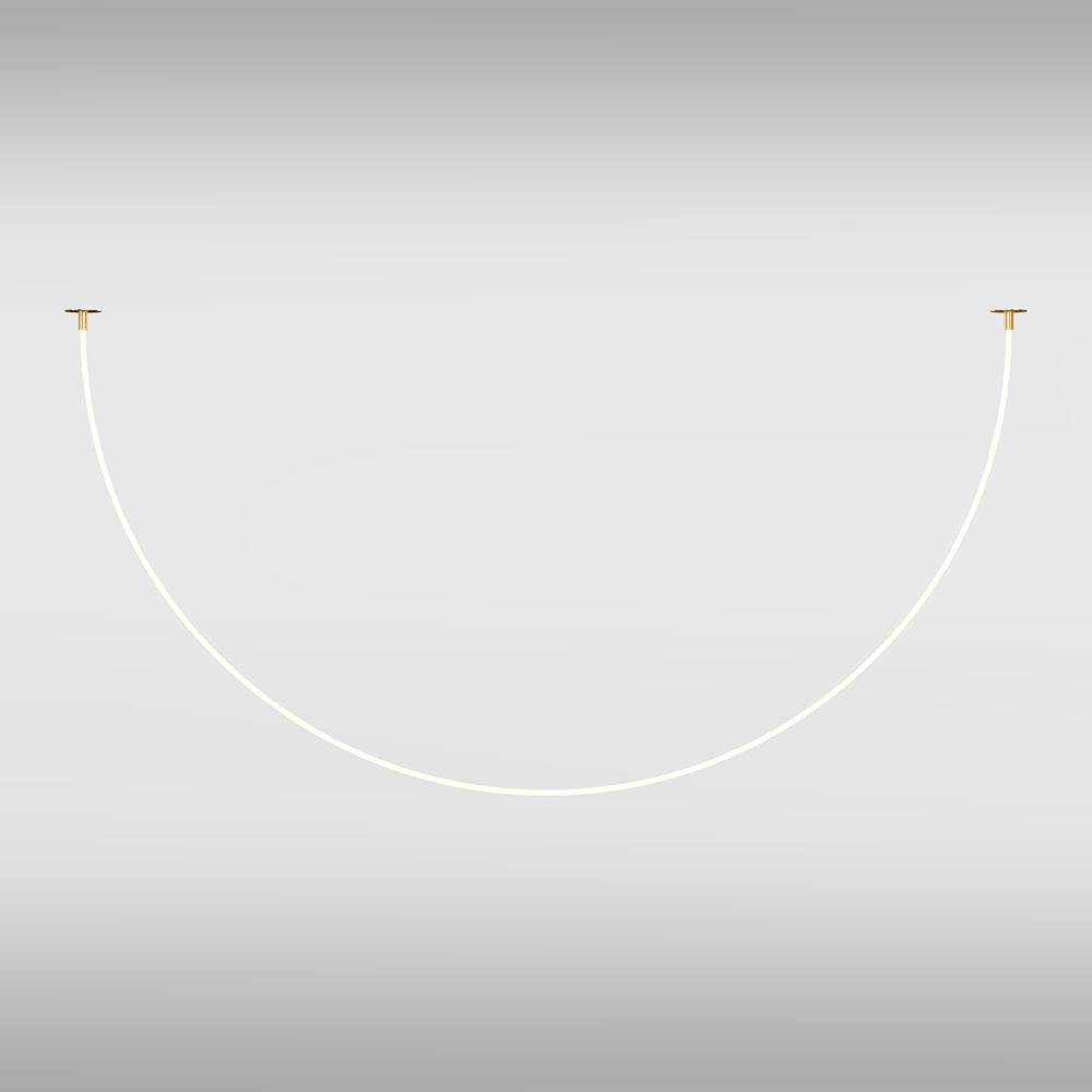 Détail des extrémités du ruban LED avec fixations dorées sur fond clair.