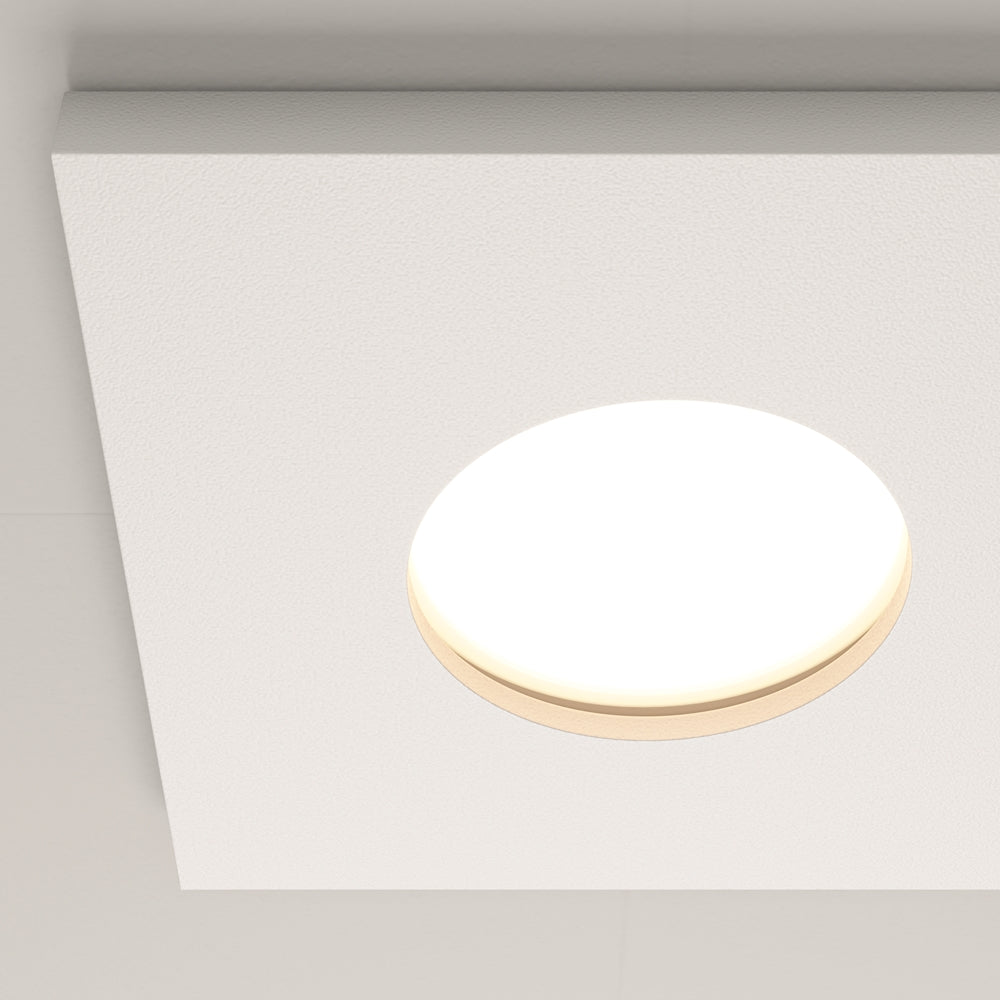 Version ronde du spot beige avec son diffuseur central éclairé