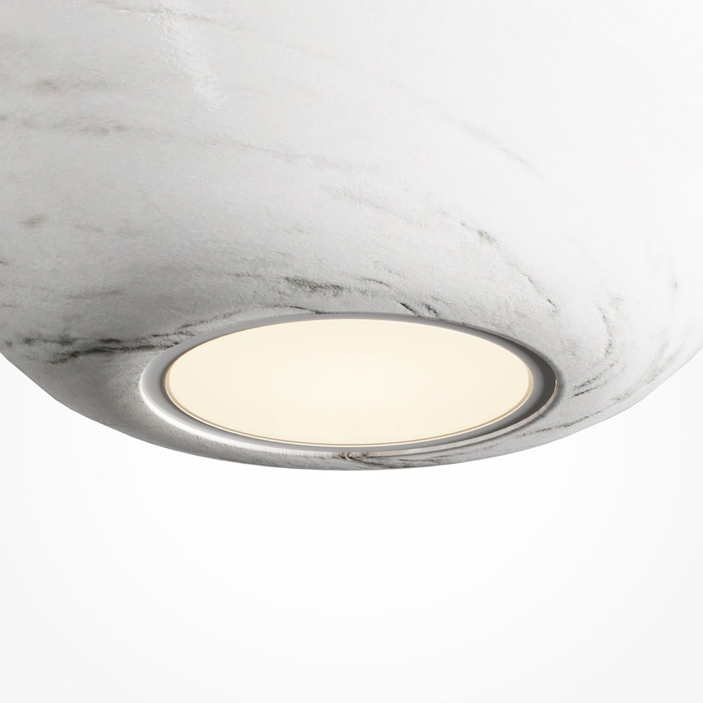 Gros plan sur la sortie de lumière sous le diffuseur marbré