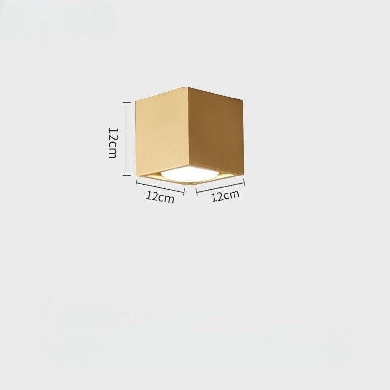Schéma technique d'un plafonnier cubique doré de 12 cm avec diffuseur blanc.