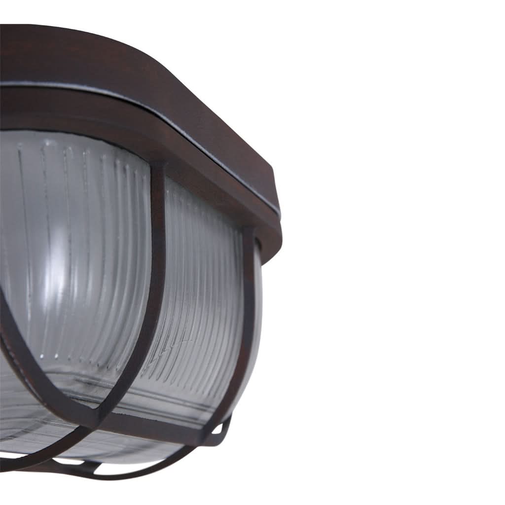 Gros plan de la verrerie striée et du cadre métallique, luminaire éteint.